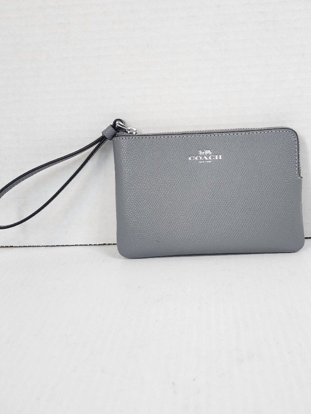 Coach Pebbled Leather Corner Zip Wristlet – Silver